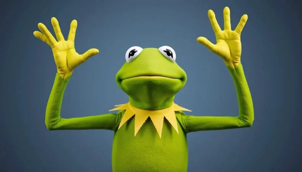 Kermit żaba w swojej ikonicznej pozie z uniesionymi łapkami i okrzykiem Yaaaaay!