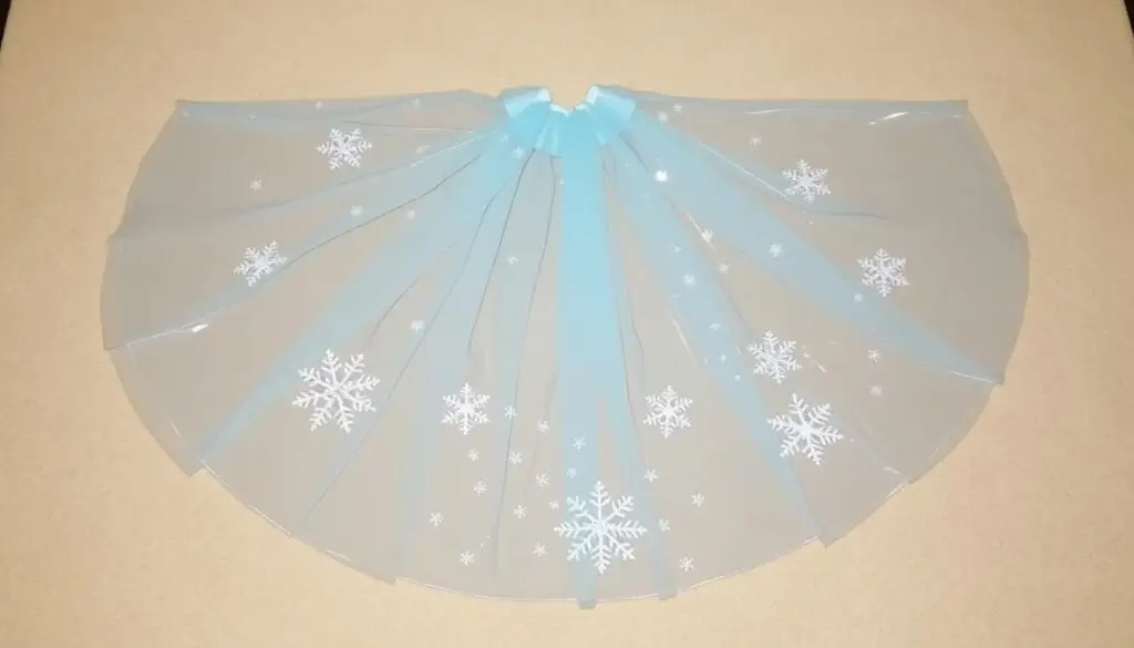 Peleryna do stroju Elsy z ozdobnymi płatkami śniegu